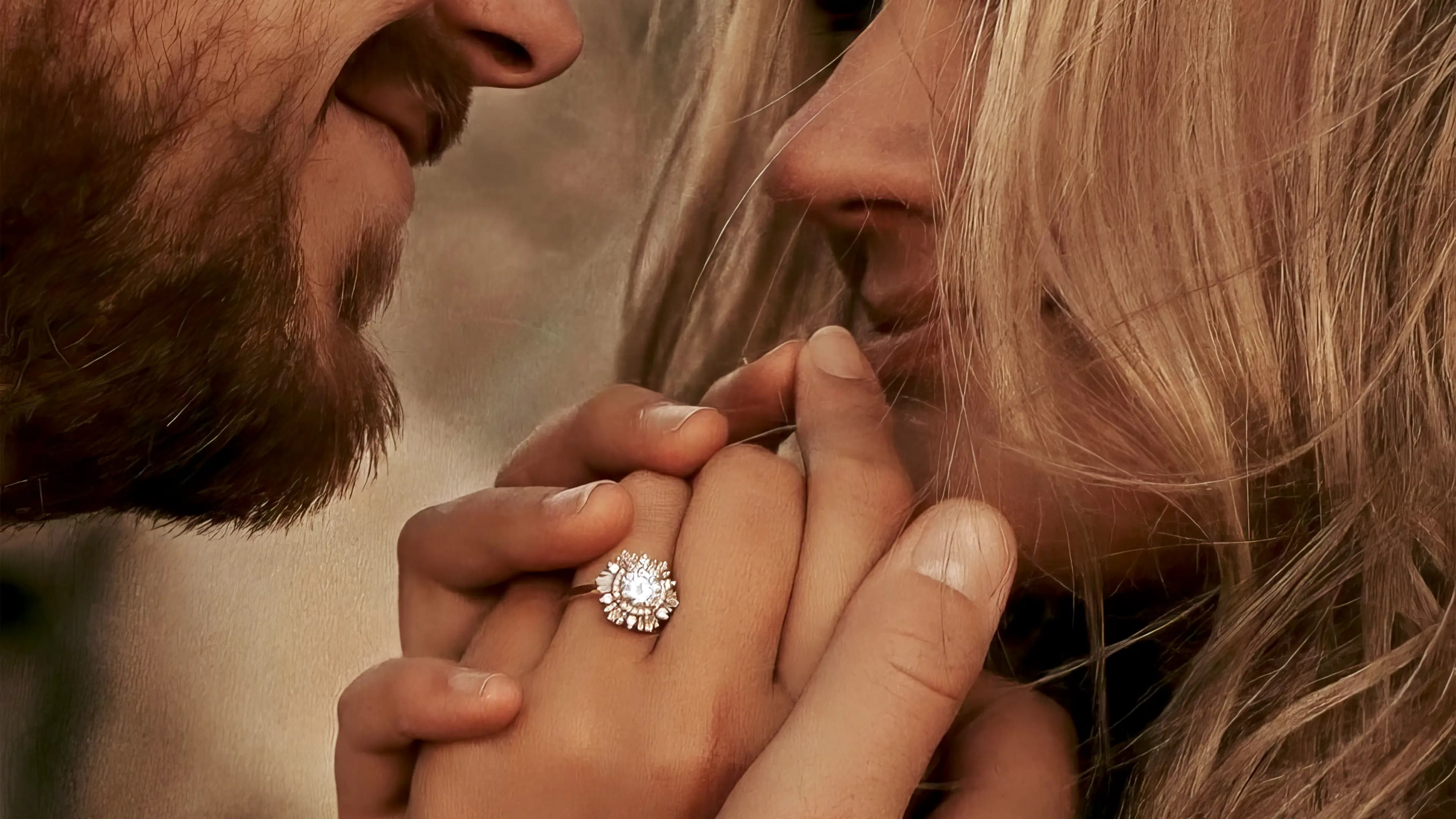 A photograph of a couple who is newly engaged showing of a Heidi Gibson ring