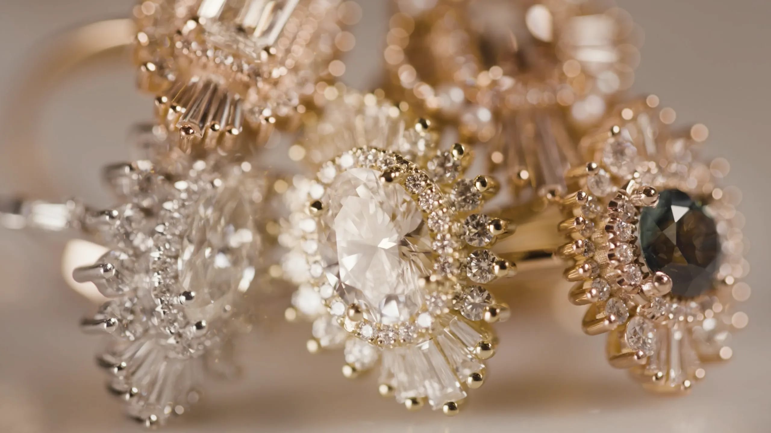 A collection of Heidi Gibson rings on a white background