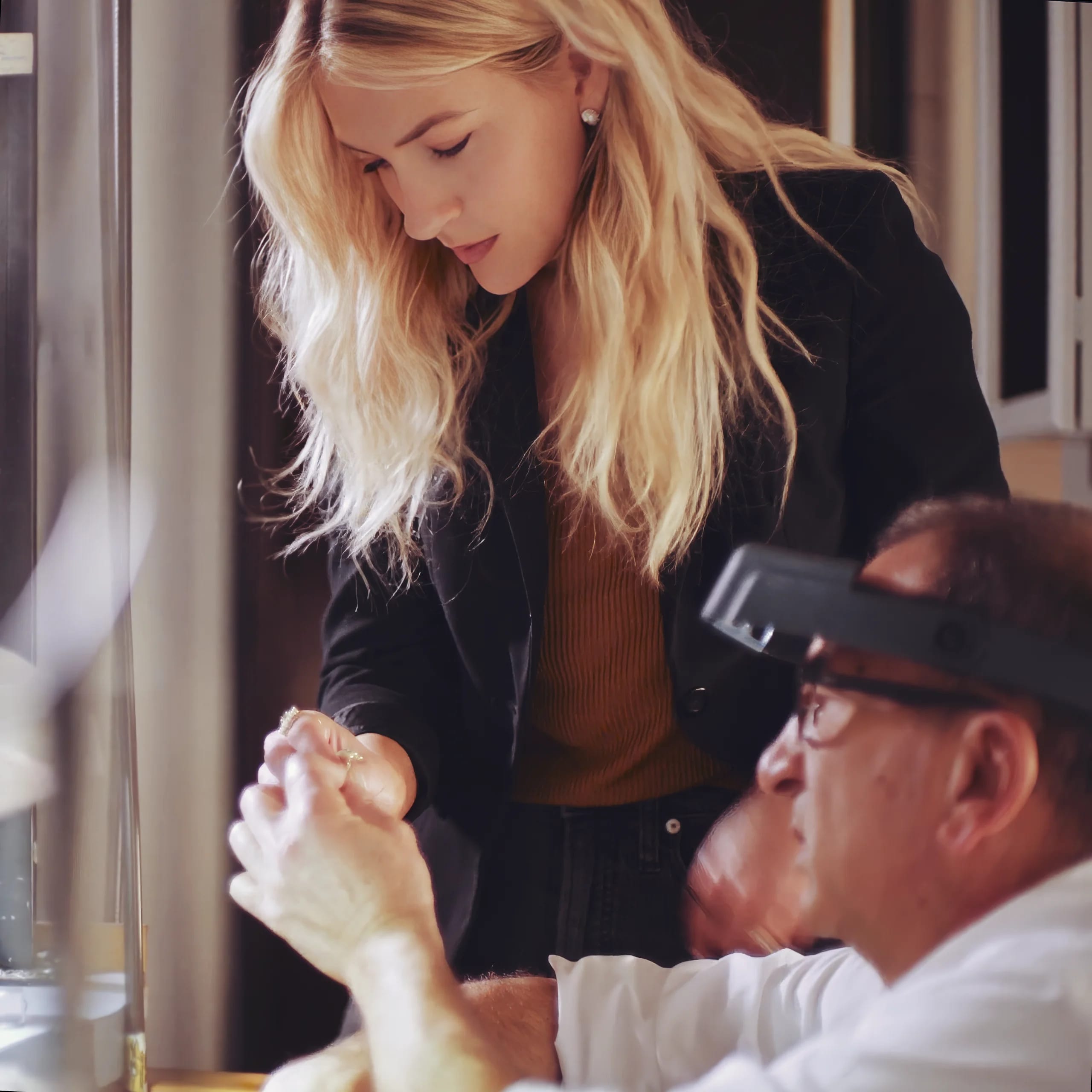 A model browsing paintings while playing with her Heidi Gibson rings